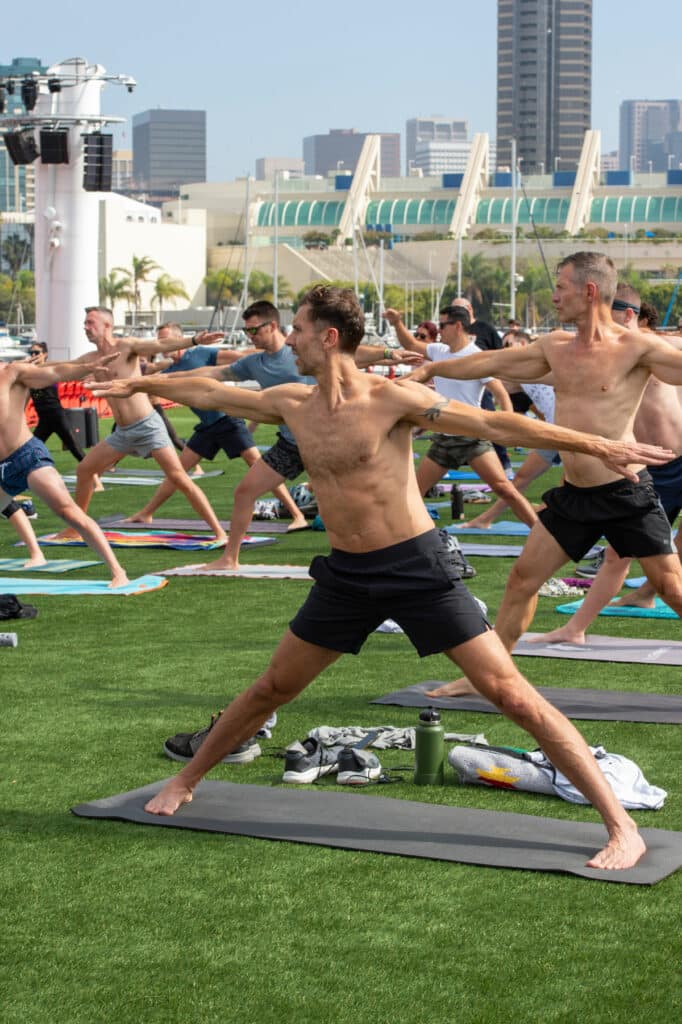 A person lifting a pair of dumbbells in a gym.
