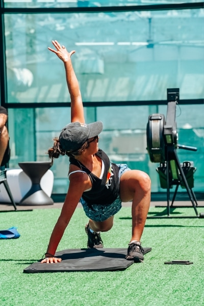woman doing full body workout at fit athletic club