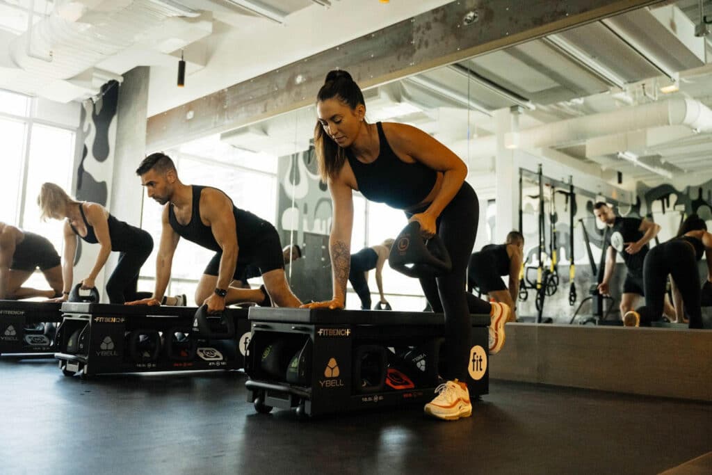 A group of people working out in a gym.