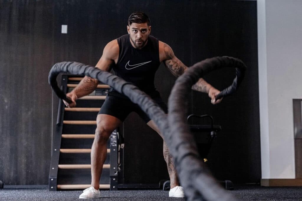 A stack of towels on a counter at a fitness center.